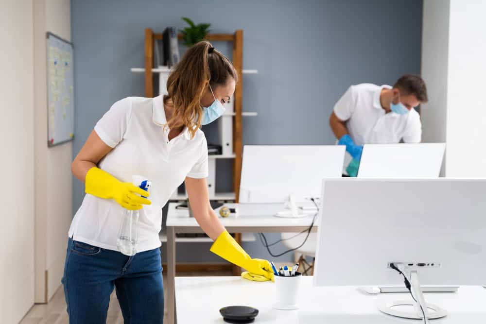 Woman cleaning an Office