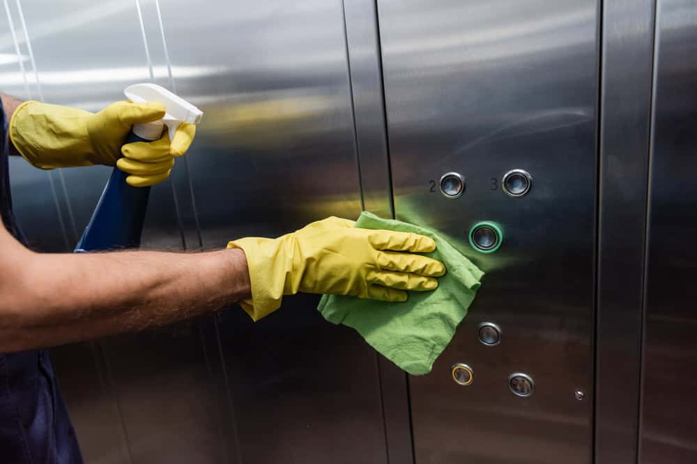 Man Cleaning an Elevator